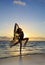 Female dancer standing in the ocean