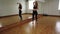 Female dancer training dance while rehearsing in dance studio.