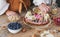 Female decorating a homemade cheesecake with berries