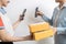 Female delivery worker deliver parcel box,happy child girl receive ordered goods from online shopping,payment purchase on mobile