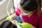 Female dentist cleaning teeth of patient