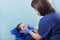 A female dentist doctor makes an inspection of a patient of a teenage girl in the clinic.