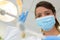 Female dentist holding dental lights in dental clinic