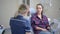 Female dentist talking with patient at dental clinic office