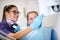 Female dentist at work with child in dental chair