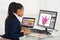 Female Designer Drawing Flower On Computer Using Graphic Tablet