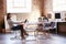 Female Designer Sitting At Meeting Table Working On Laptop