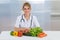 Female dietician with vegetables