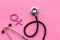 Female diseases concept. Stethoscope near female sign on pink background top view copy space