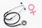 Female diseases concept. Stethoscope near female sign on white background top view
