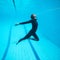 Female diver flying underwater