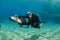 Female diver on underwater scooter