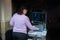 Female doctor adjusts ultrasound scan equipment for sonography diagnostics