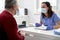 Female doctor conducts a medical interview with the senior patient