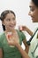 Female Doctor Giving Medicine To Girl