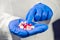 Female doctor hand full of various pills and medications