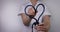 female doctor with heart shaped stethoscope. healthcare job love, cardiology or health insurance concept