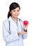 Female doctor hodling heart shape squeezing ball