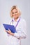 A female doctor holding clipboard