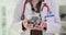 Female doctor holds a jar of coins in clinic