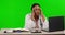 Female doctor, laptop and stress headache by green screen with tired face, planning or schedule at job. Black woman