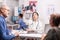 Female doctor looking at patient x-ray