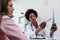 Female doctor looking at test results of her patient. Doctor and patient talking over a medical test result.