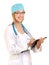 Female Doctor or Nurse with Stethoscope Writing in Note Pad