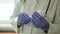 A female doctor opening a sterile syringe and checking a needle.