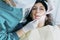 Female doctor operates a patient wearing protective devices in the dental office - Health and wellbeing concept