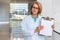 Female doctor physician holding up blank clipboard, white card template, health care and medicine