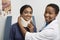 Female Doctor Putting Brace On Patient\'s Neck