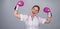 A female doctor raised her hands in pink boxing gloves as a sign of victory over the disease.