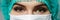 Female doctor\'s face wearing protective mask