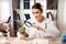 Female doctor sitting at desk in office with microscope and stethoscope. Woman is looking at broccoli with magnifyer.