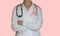 Female doctor with stethoscope and pink ribbon, isolated, Health care, medical breast cancer awareness concept
