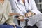 Female doctor talking to a patient on a tablet