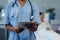 Female doctor using digital tablet in the ward at hospital