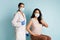 Female Doctor And Vaccinated Patient Gesturing Thumbs-Up Approving Vaccination, Studio