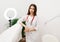 Female doctor in a white cabinet with a stethoscope. Portrait of a therapist in a medical office