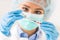 Female doctor working with syringe needle and ampoule of medicine. A scientist in sterile clothes is making a vaccine drug