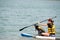 Female with a dog on the paddle board