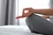 Female doing hand asana during meditation indoors