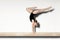 Female Doing Handstand On Balance Beam