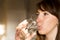 Female drinking from a glass of water. Health care concept photo