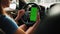 Female driver using a smartphone inside the car. Chromakey smartphone with green