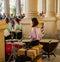 Female Drummer musician performing in front of the live audience during summer concerts