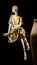 -female dummy in colourful dress with black background date 30 April 2019. dummy in fancy dress with q big vase in right corner.