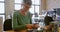 Female electrical engineer soldering a circuit board 4k