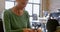 Female electrical engineer soldering a circuit board 4k